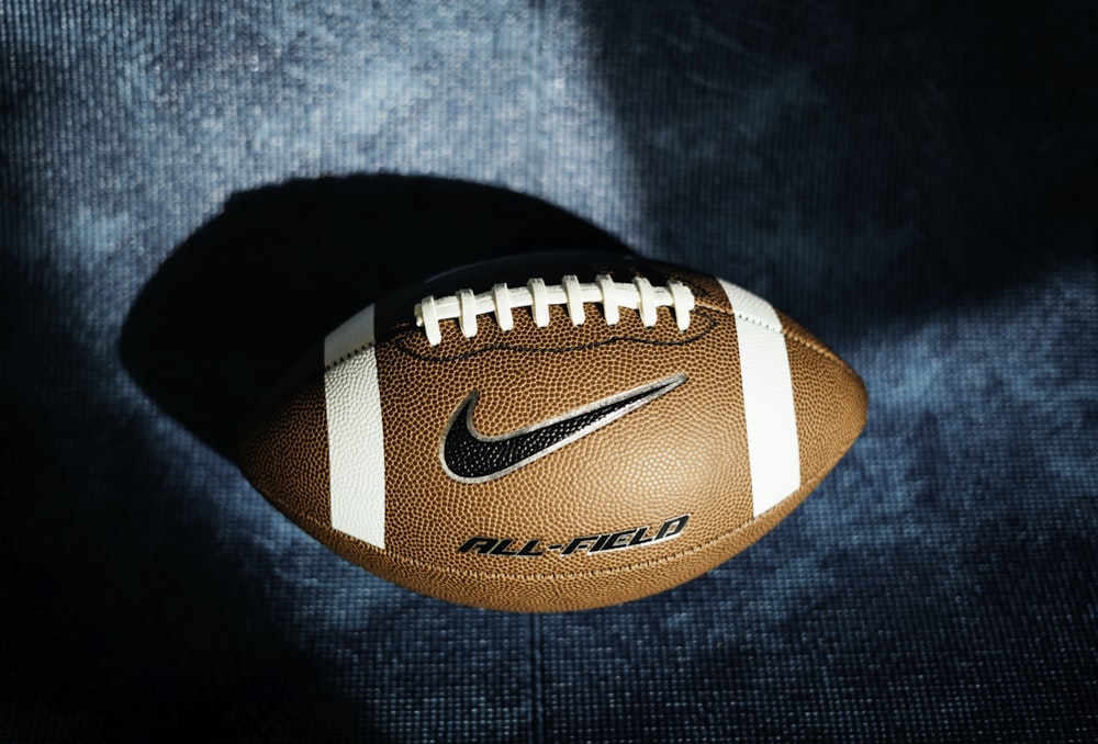 a close up of a football on a blue background
