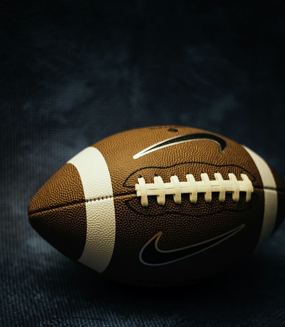 a close up of a football on a black background