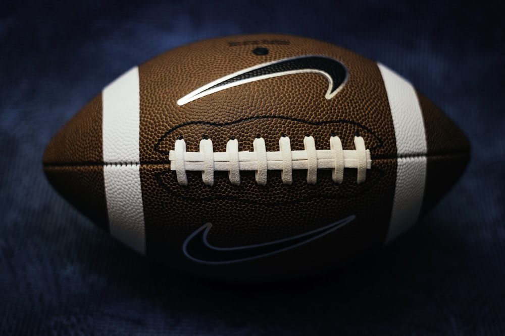 a close up of a football on a blue background