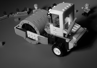 a black and white photo of a construction vehicle