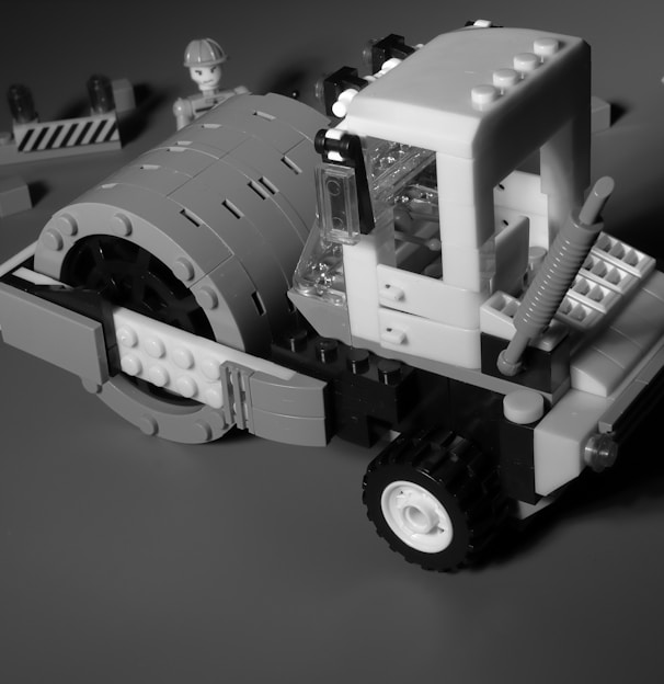 a black and white photo of a construction vehicle