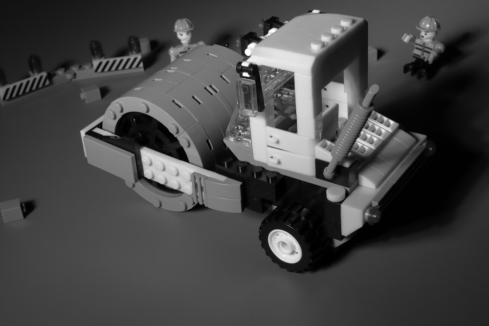 a black and white photo of a construction vehicle