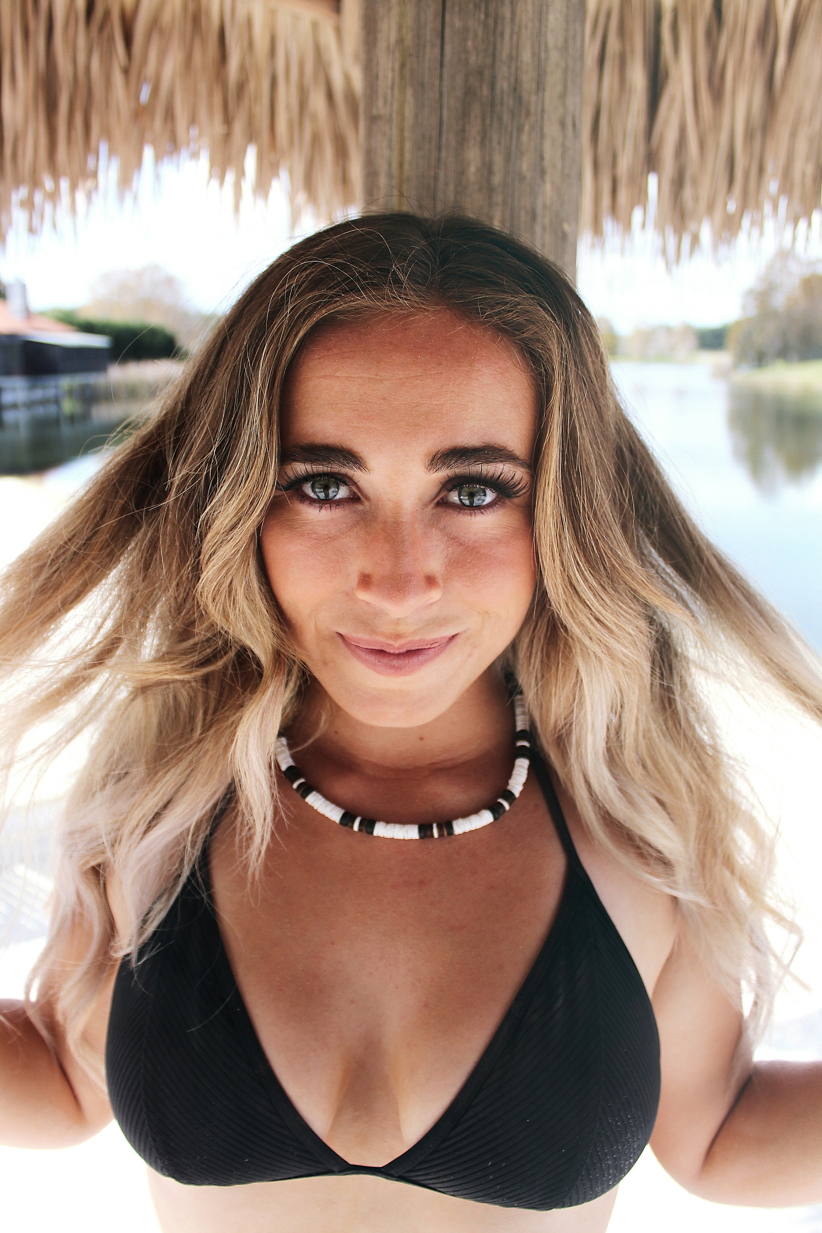 a woman in a bikini posing for a picture