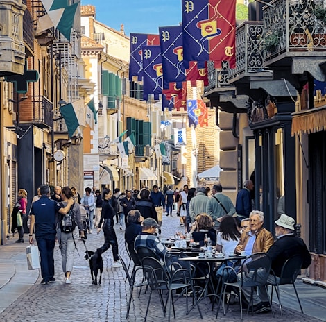 A vibrant street scene showing diverse people engaging in a community event celebrating European culture.