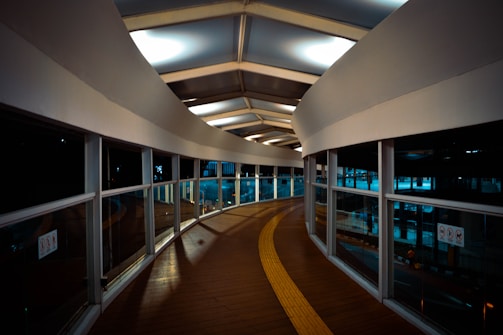 Flap barriers guiding pedestrian flow in a corporate lobby.