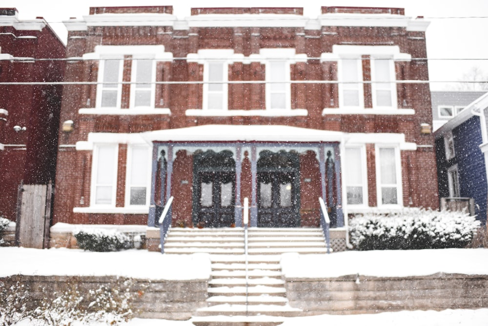 a red brick building with steps leading up to it