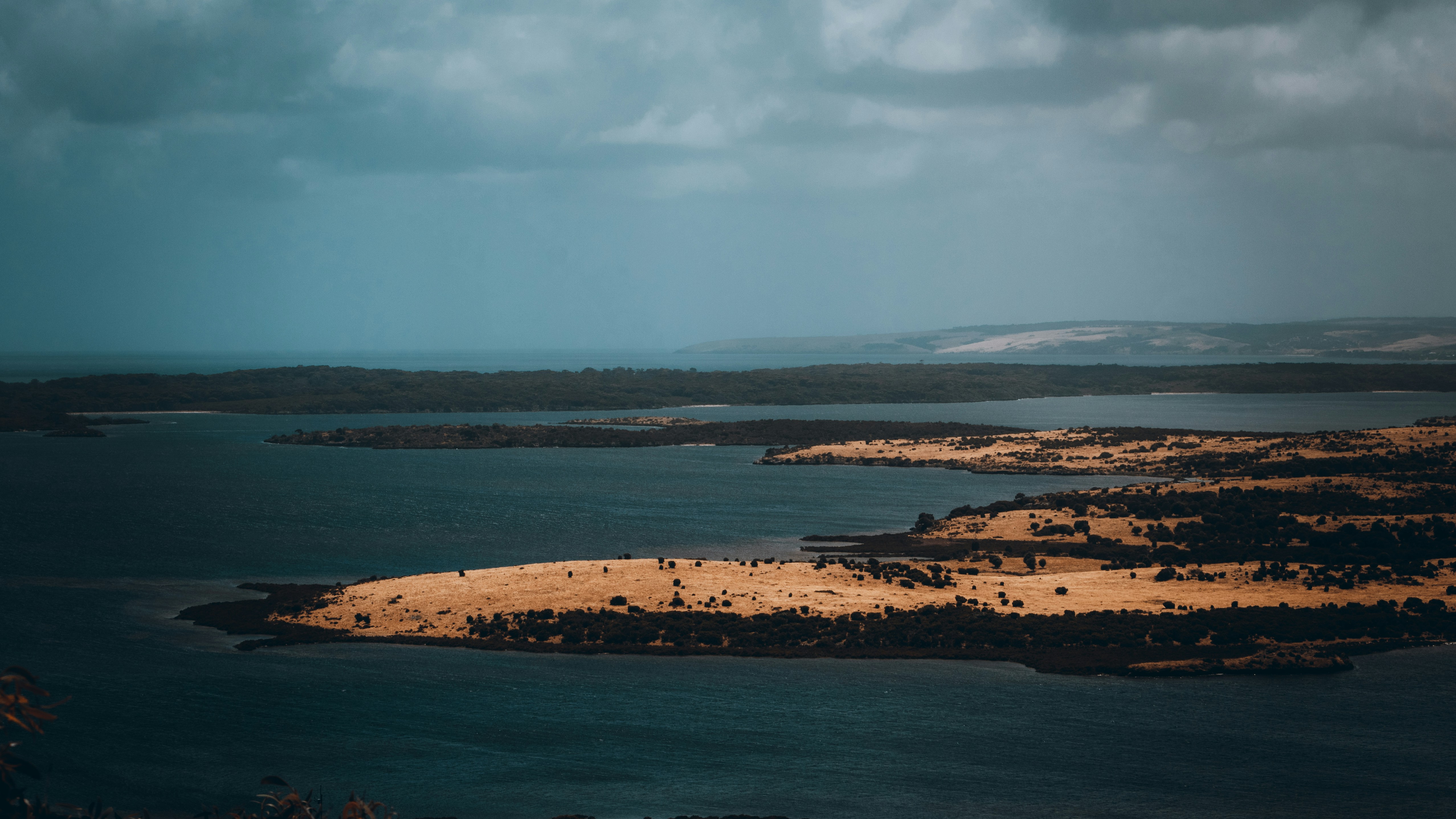 a body of water surrounded by land and trees, The landscapes on Kangaroo Island are truly unique - this photo showcases the island