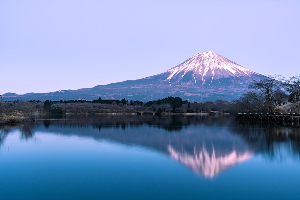 a mountain with a snow covered peak in the background