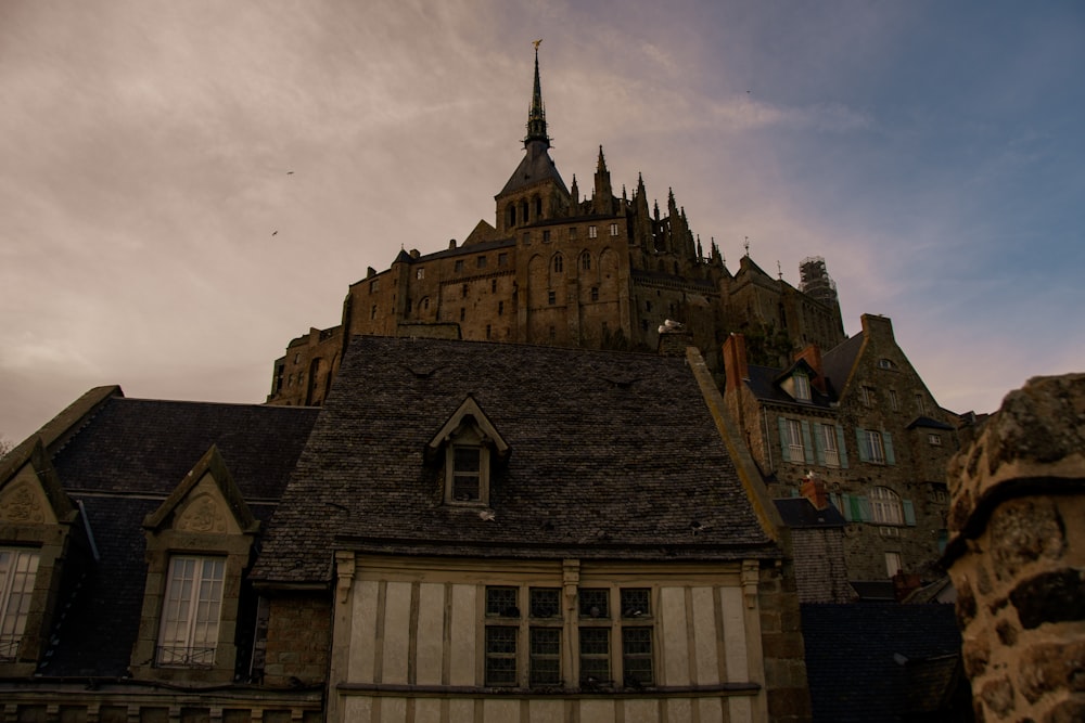 an old building with a steeple and a clock tower