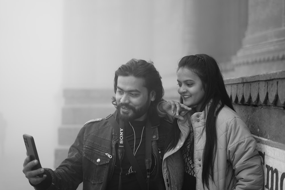 a man and a woman standing next to each other