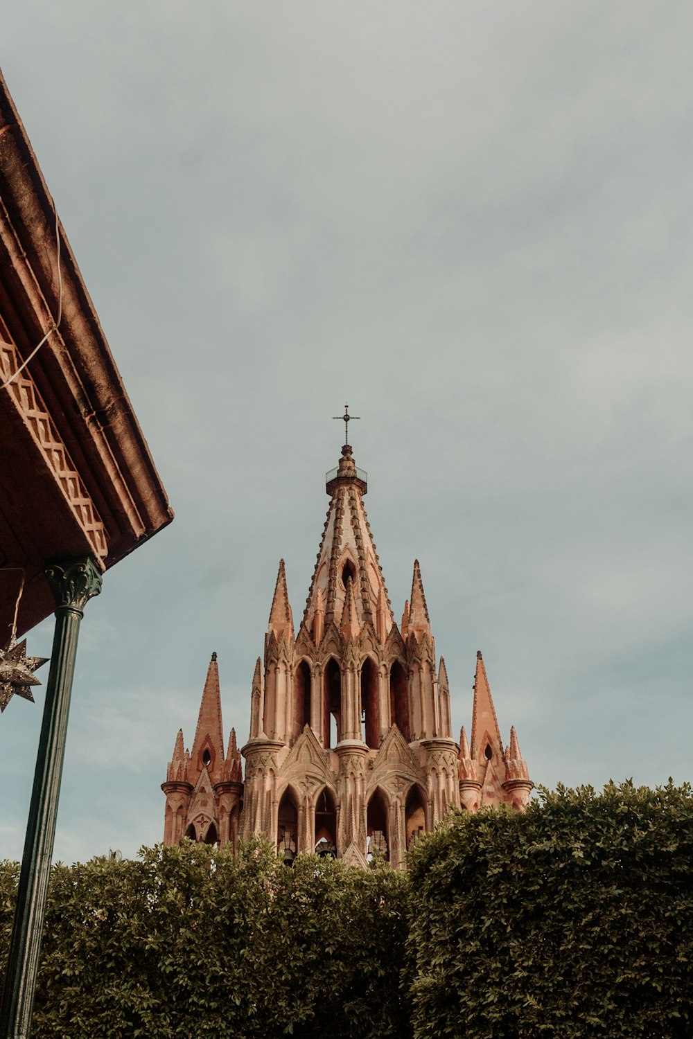 a tall building with a cross on top of it