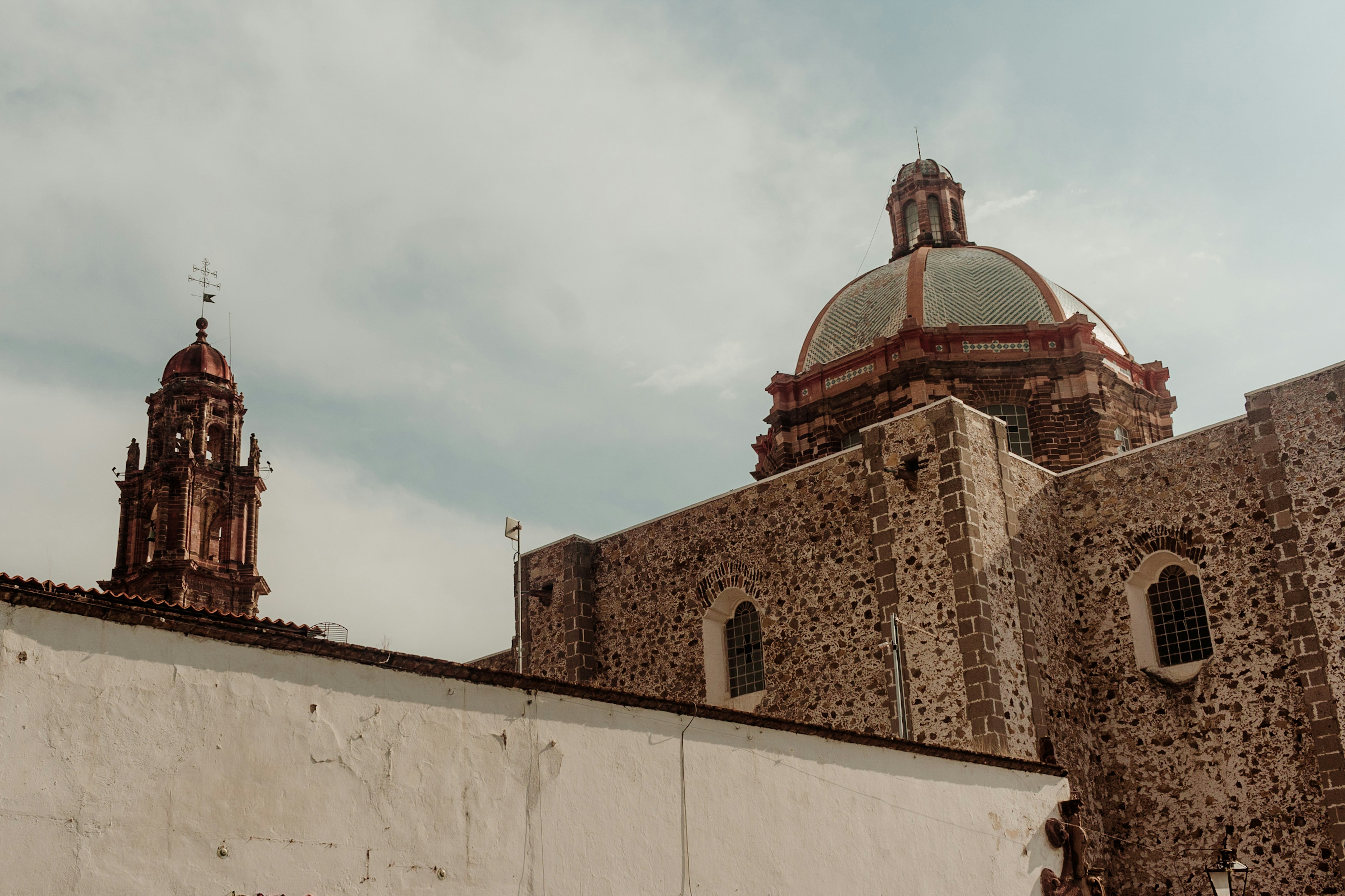 a building with two towers and a dome on top