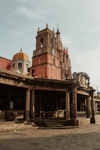 Historic San Miguel de Allende church illuminated by golden hour light.