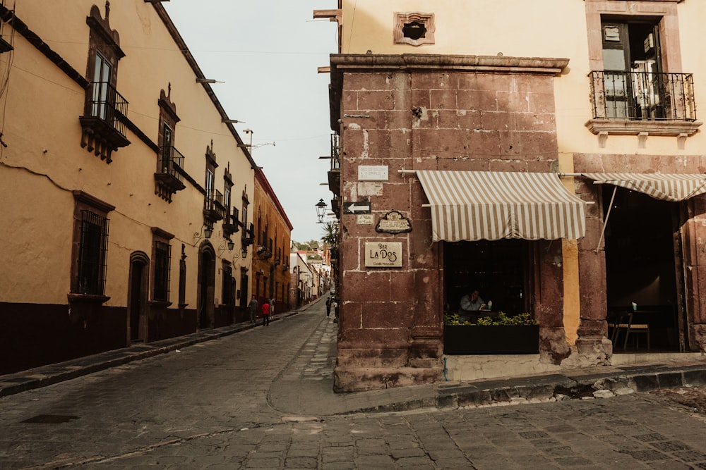 a narrow street in a city with buildings