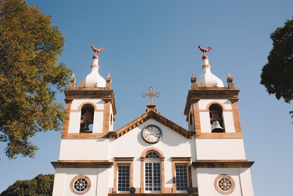 a church with two bell towers and a clock