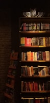 Bookshelves filled with legal books and codes in the Adalet Hukuk office.