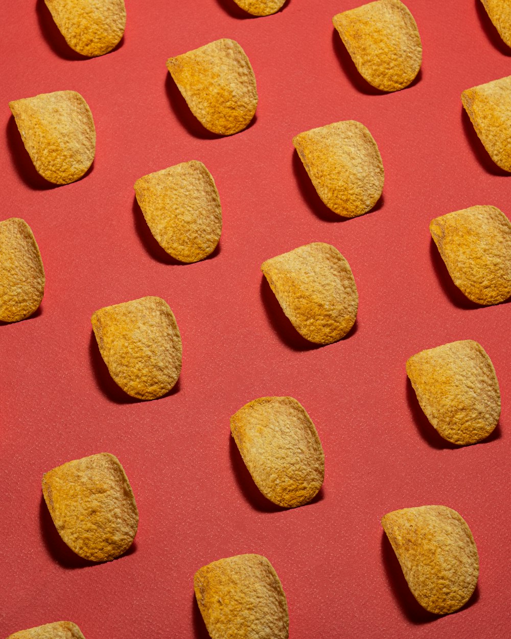 a close up of some food on a red surface