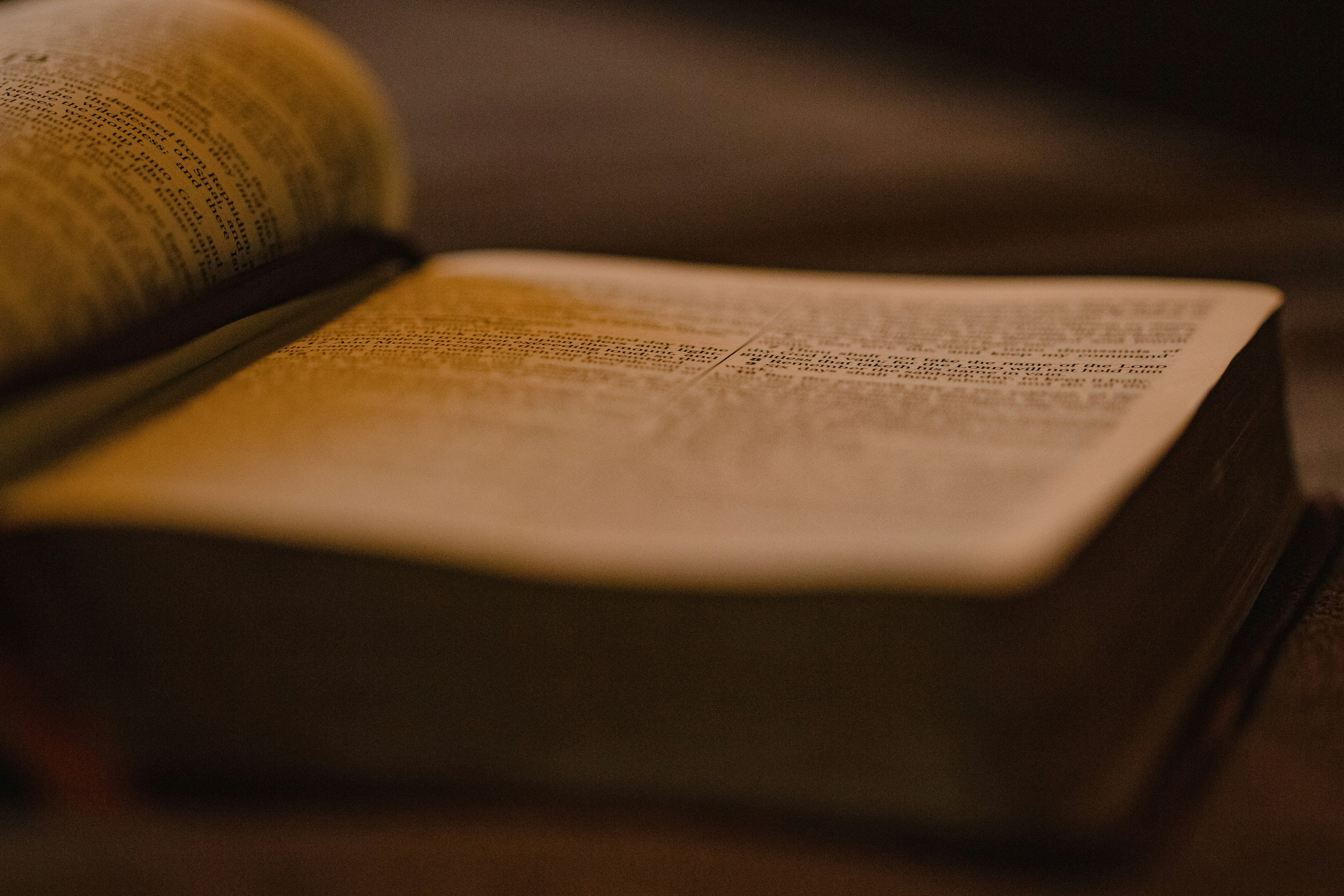 an open book sitting on top of a wooden table, Open bible