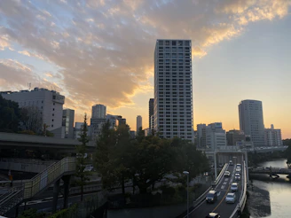 Ambato cityscape with modern buildings and busy streets at sunset