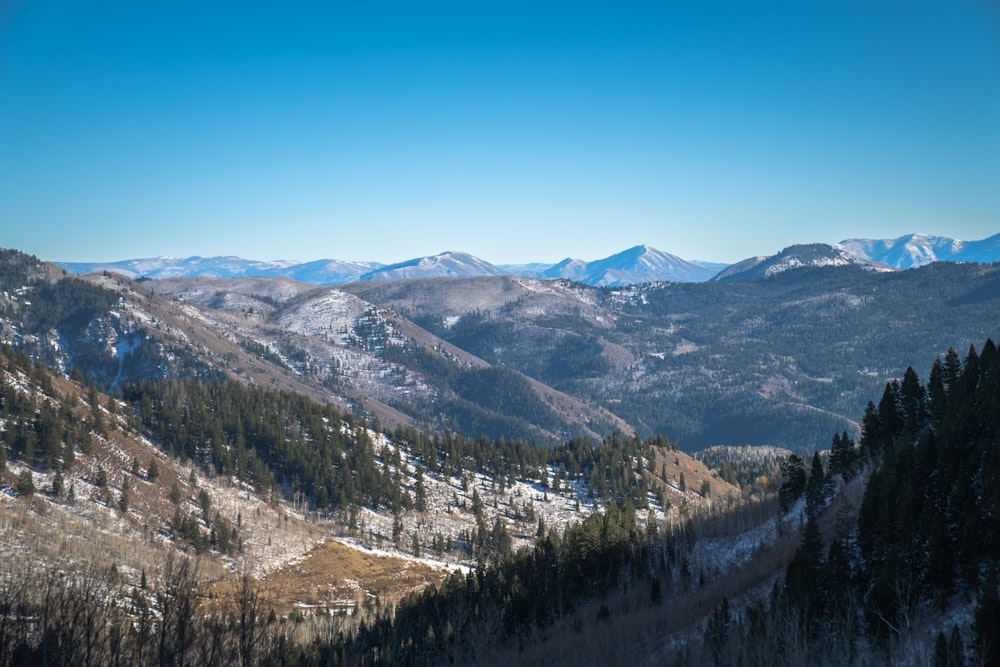 a view of a mountain range with snow on the mountains