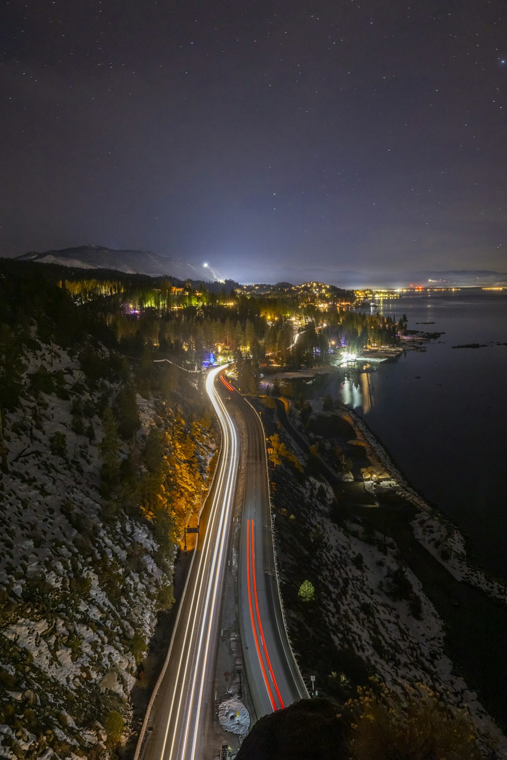 a long exposure shot of a highway at night