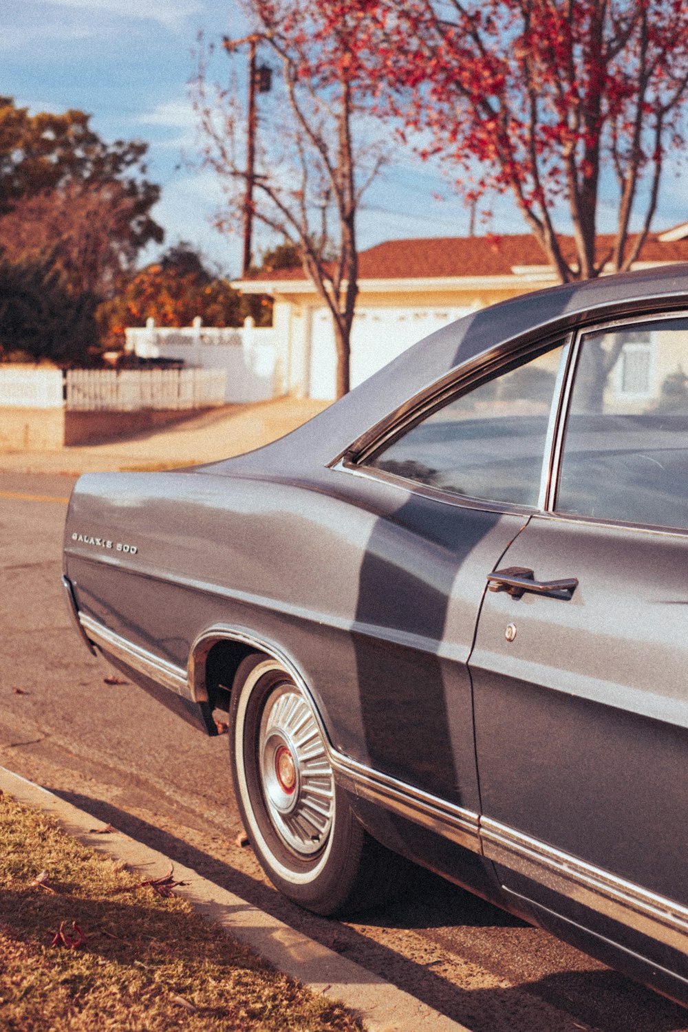 a gray car parked on the side of the road