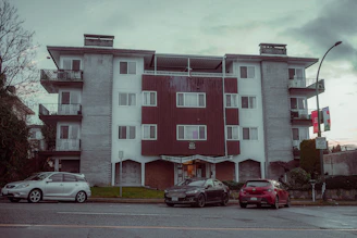 A value-add property showing a mid-century apartment building in need of renovation.