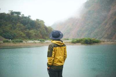 a person standing in front of a body of water