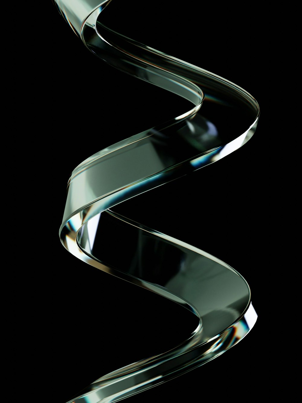 a shiny metal object on a black background