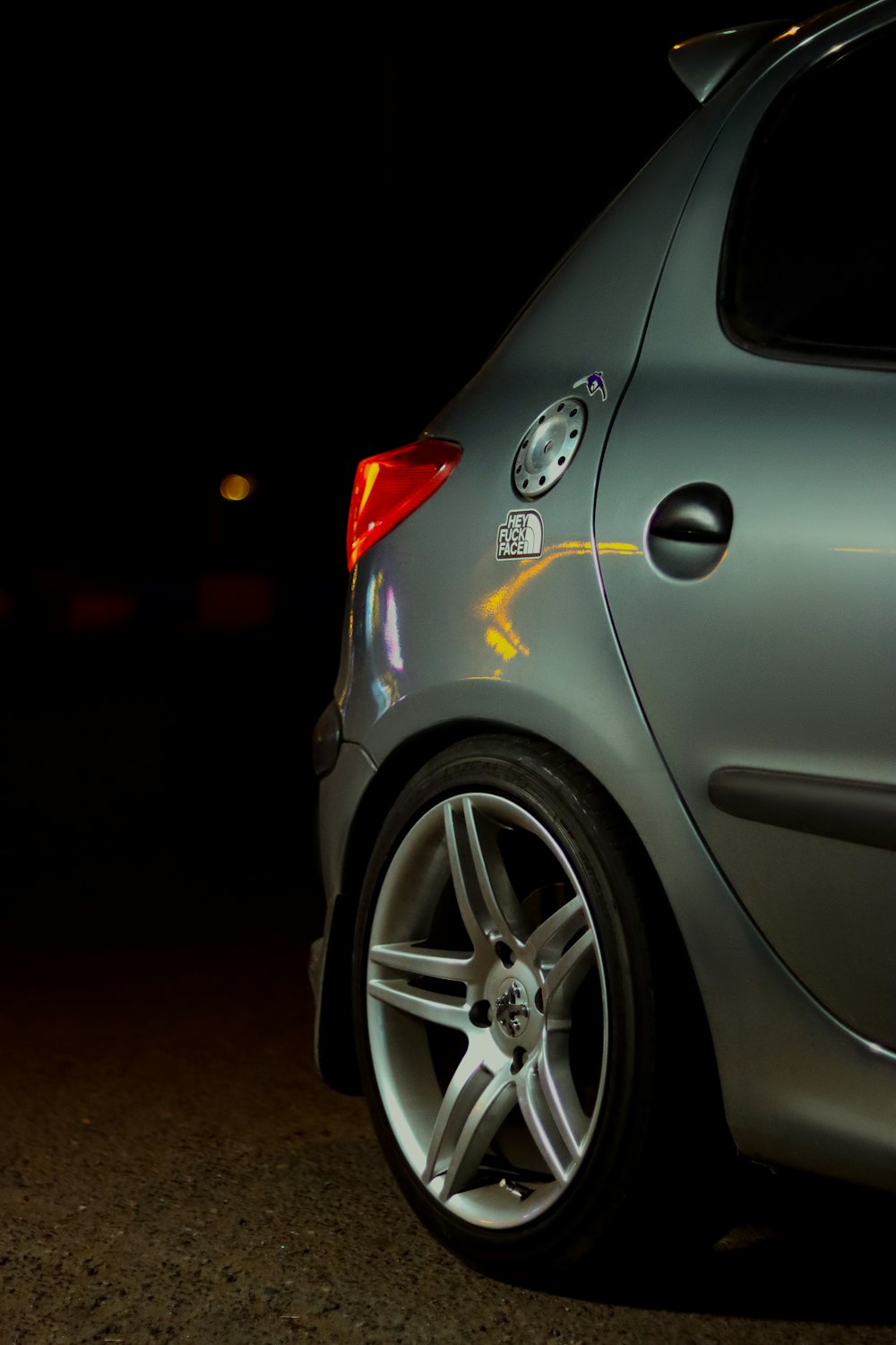 a close up of a car parked in the dark