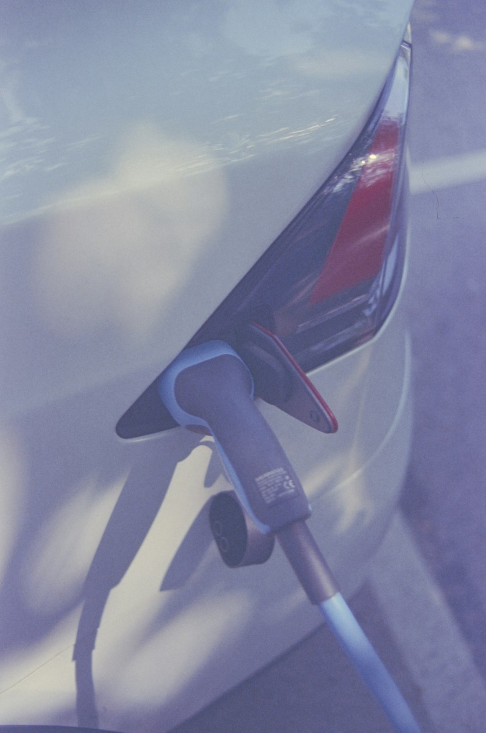 an electric car plugged in to a charging station