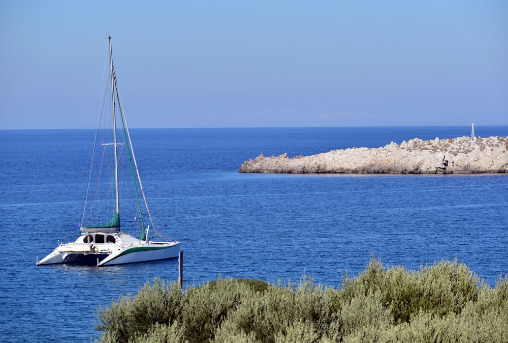 a sailboat in the middle of a body of water