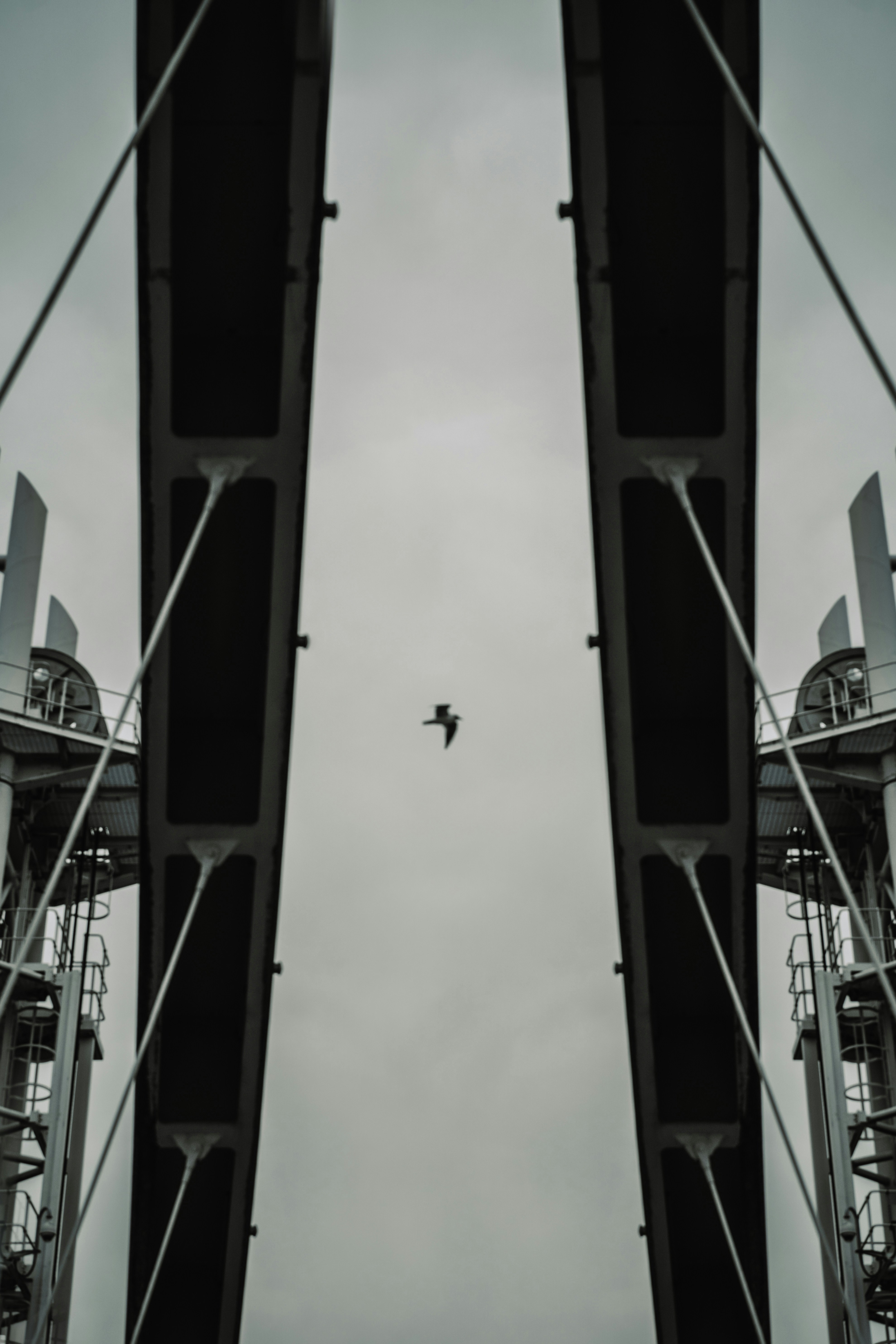 an airplane flying over a traffic light on a cloudy day