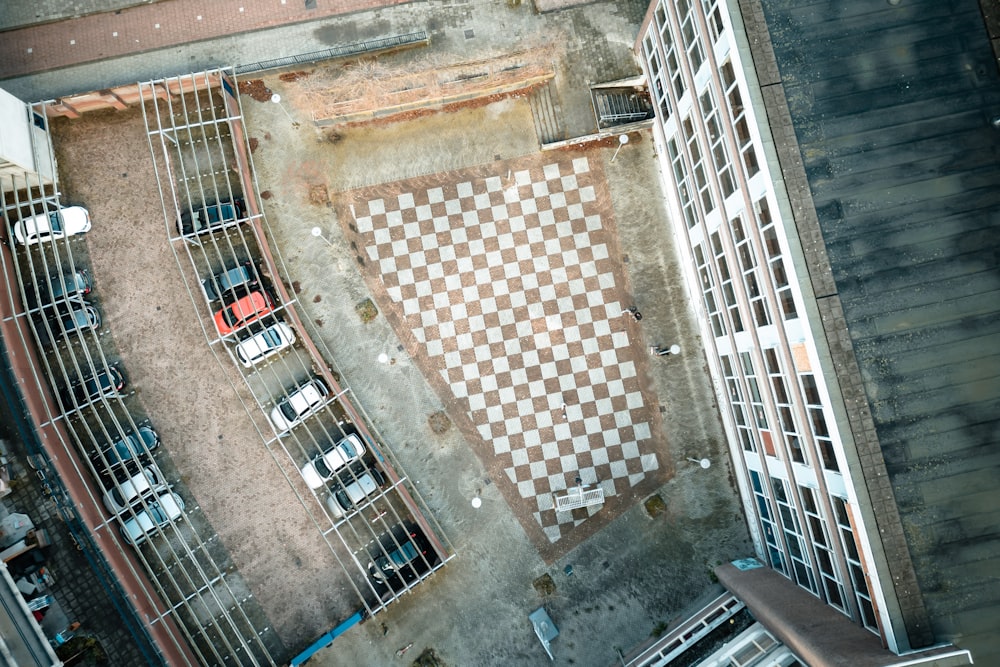 an aerial view of a parking lot with a checkered floor
