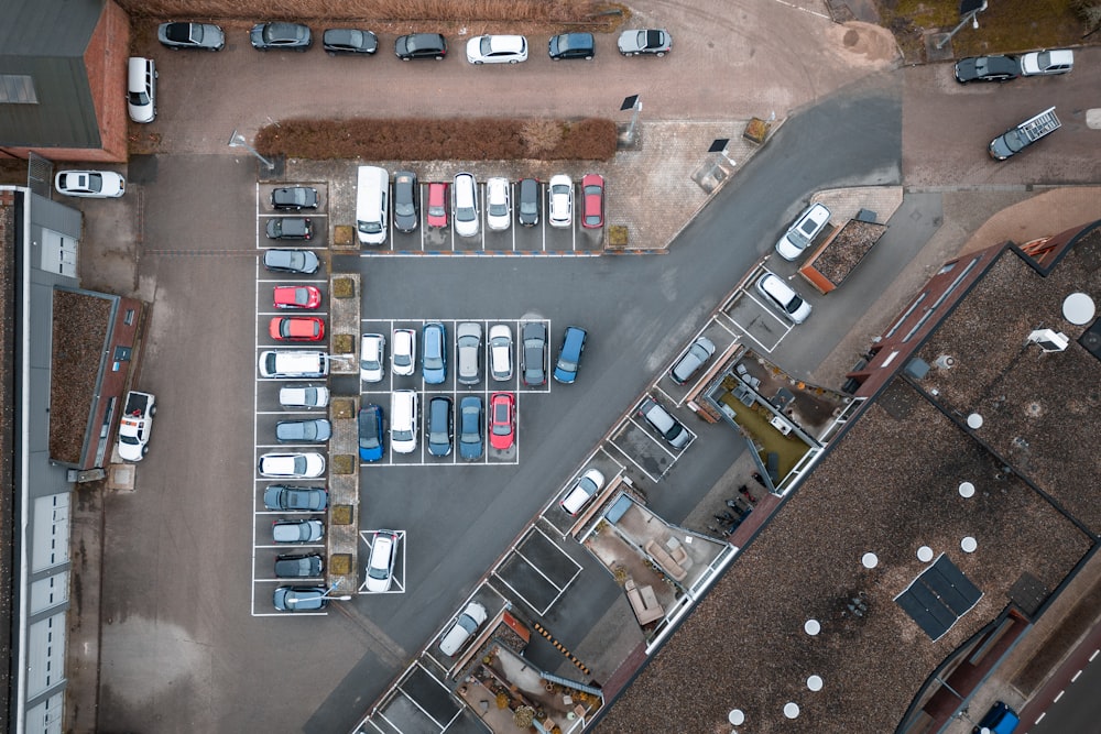 an overhead view of a parking lot with cars parked in it