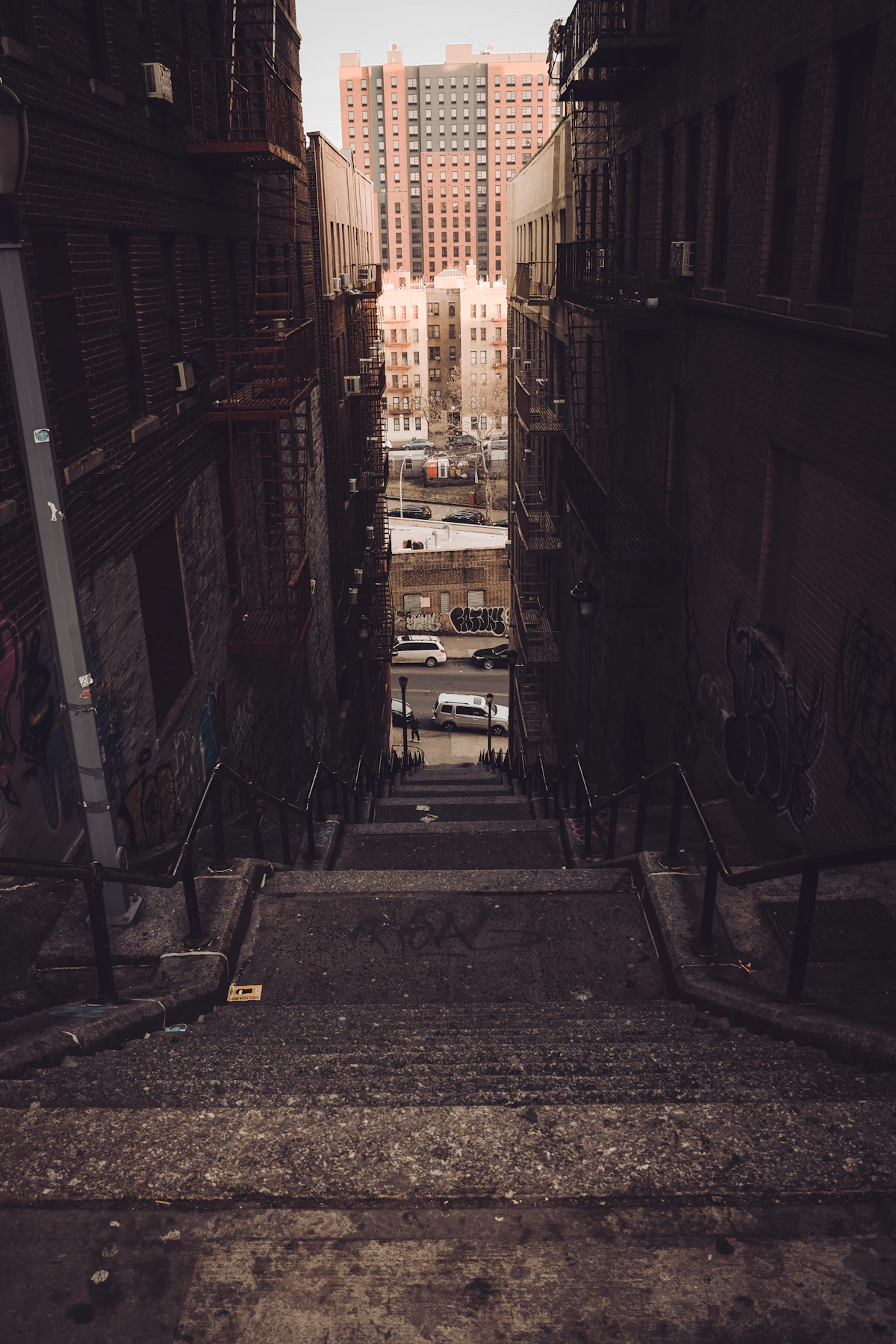 Graffiti-covered alleyway and stairs in the Bronx