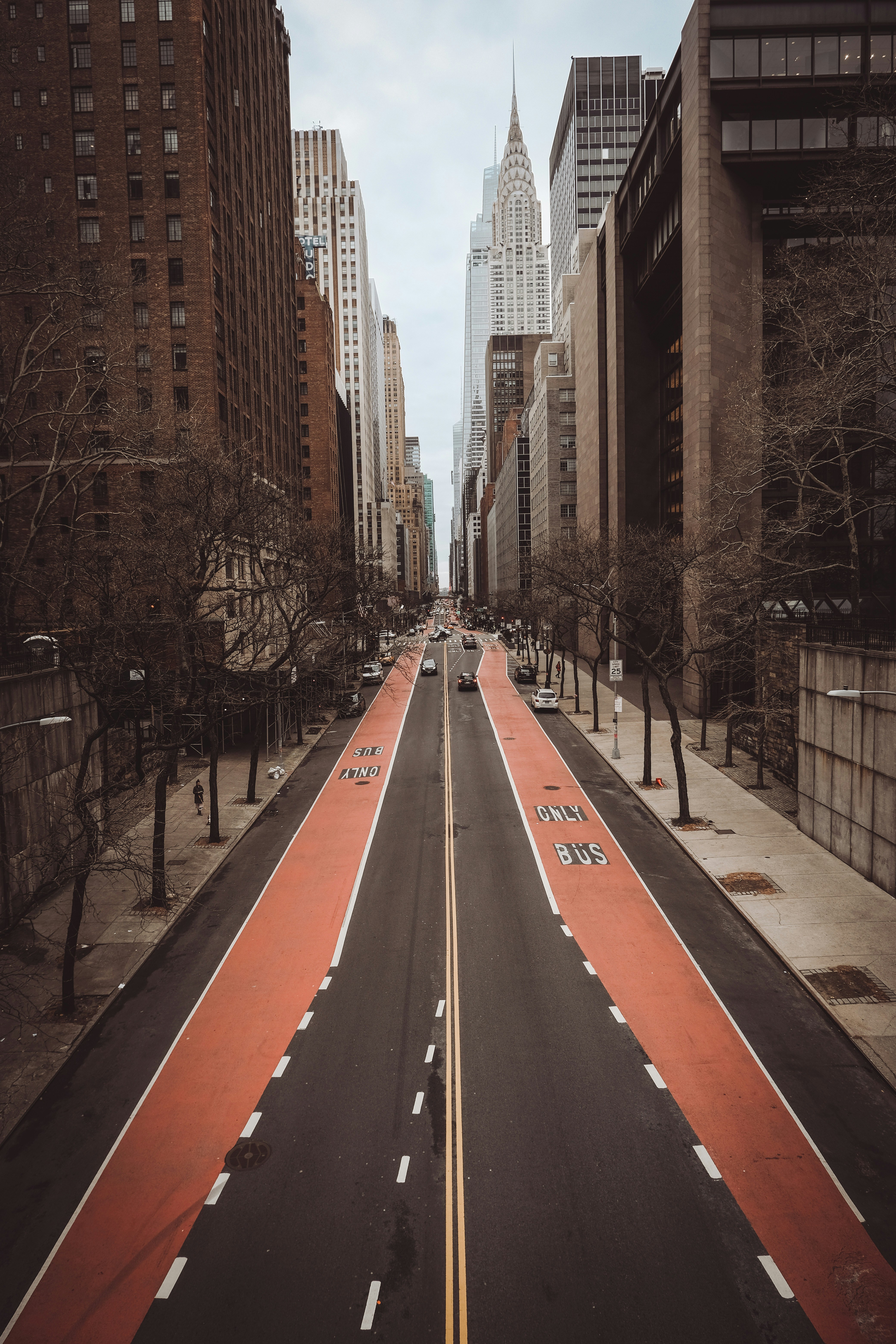 a long stretch of road with buildings in the background