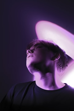 A person meditating with glowing light around their head symbolizing mental transformation.