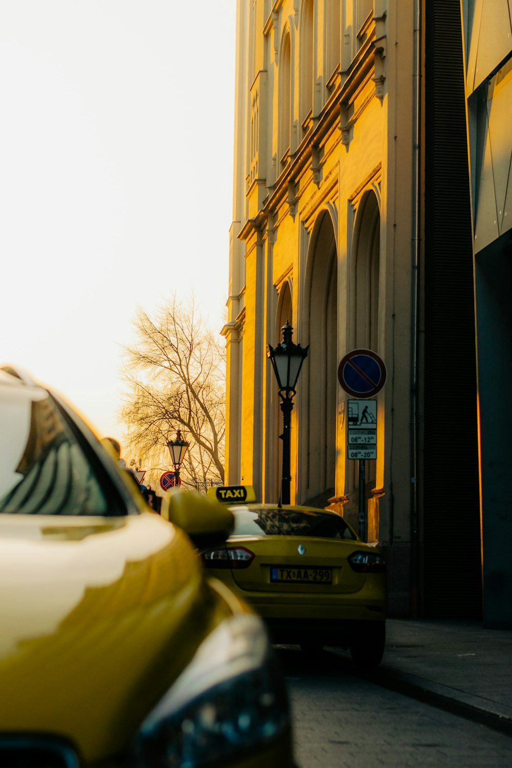 a yellow car parked on the side of the road