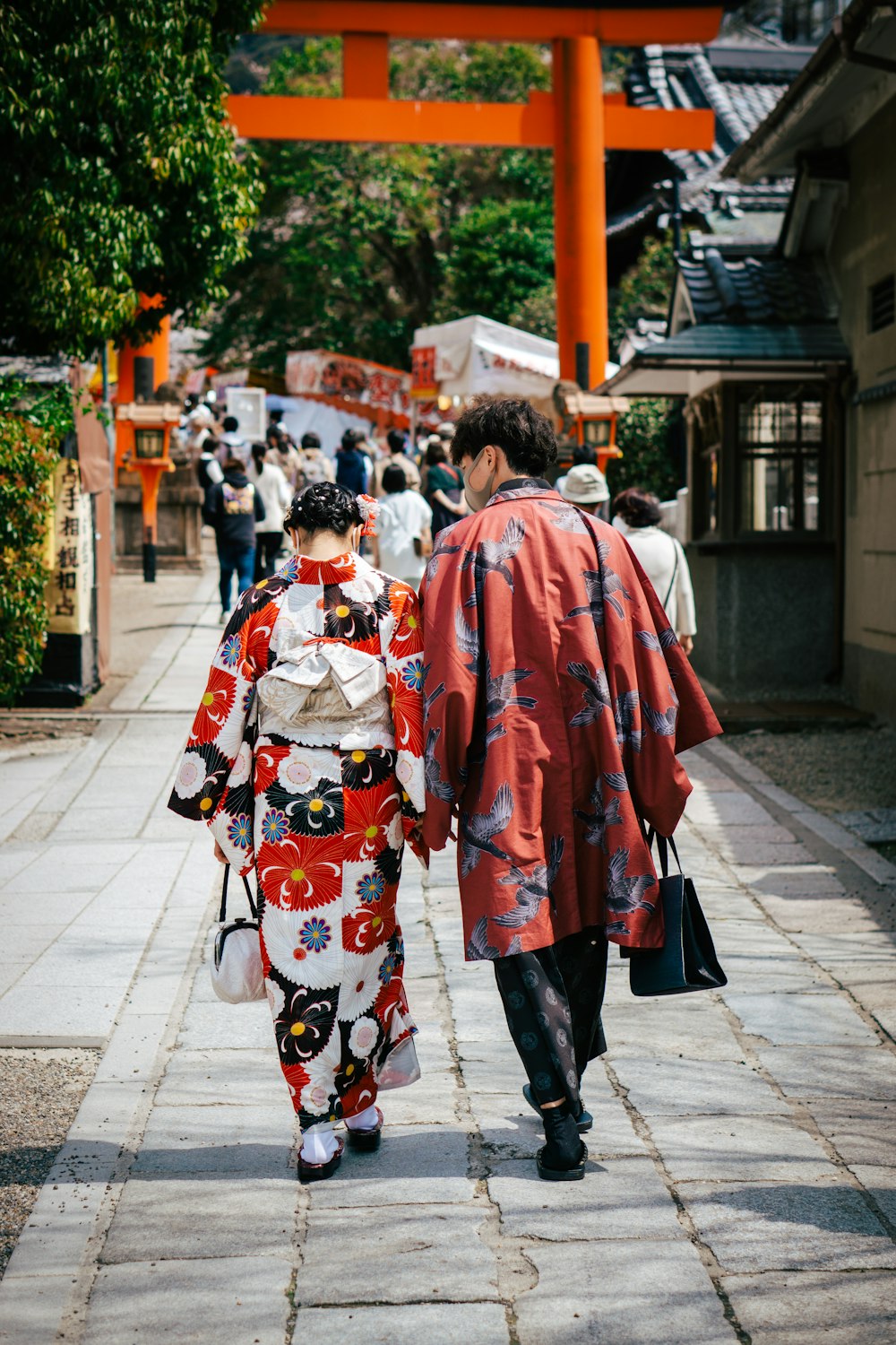 a couple of people walking down a street