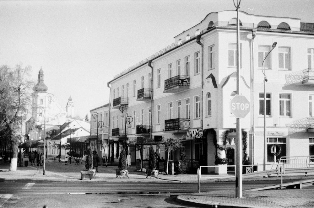 a black and white photo of a street corner