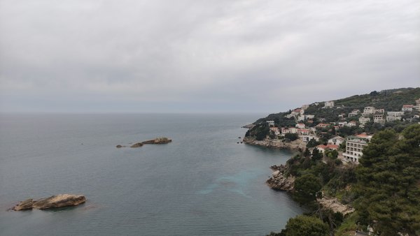 A body of water surrounded by trees and buildings — Ulcinj, Montenegro