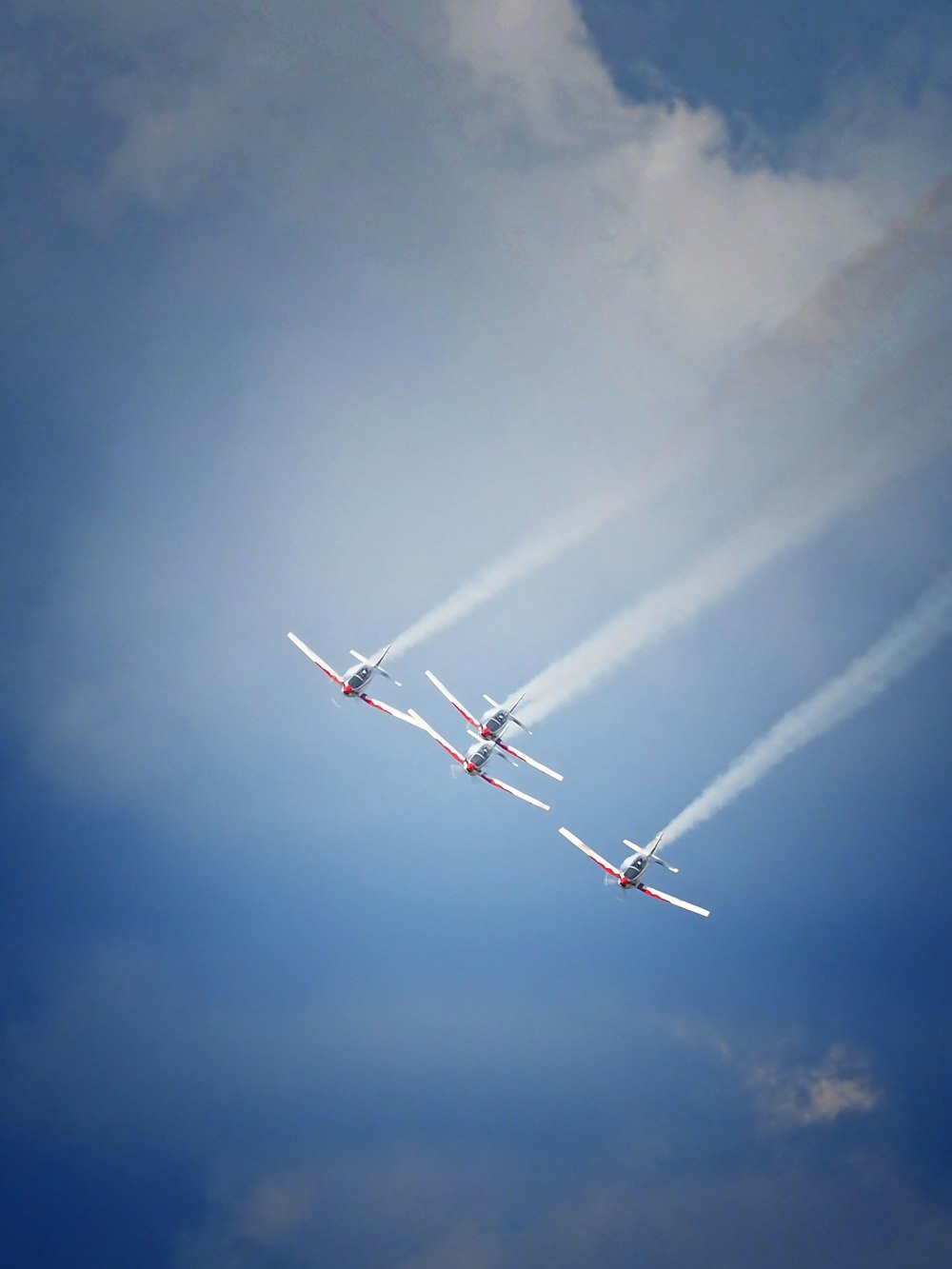 two airplanes are flying in formation in the sky