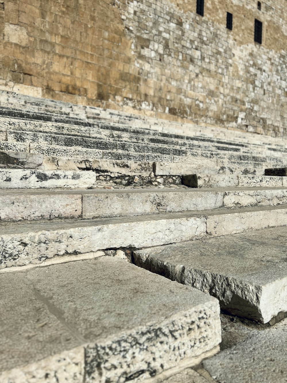 a close up of stone steps in front of a building