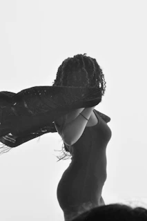 A faint silhouette of a twirling girl, her hair and skirt swirling gently in the breeze