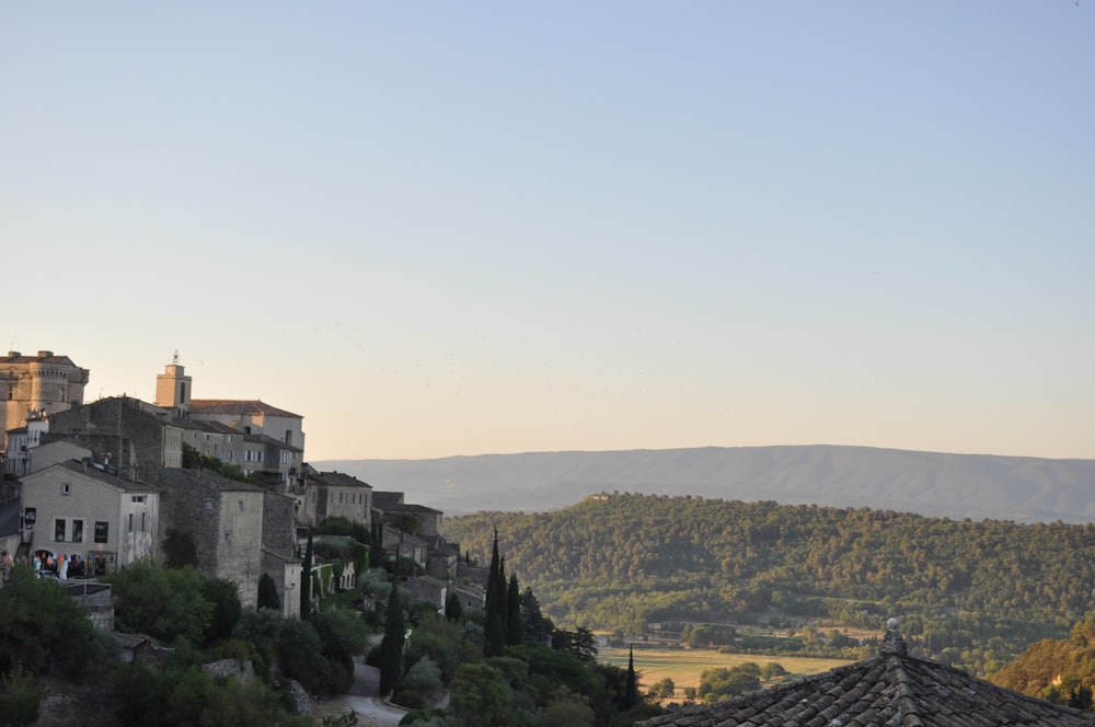 a village with a mountain in the background