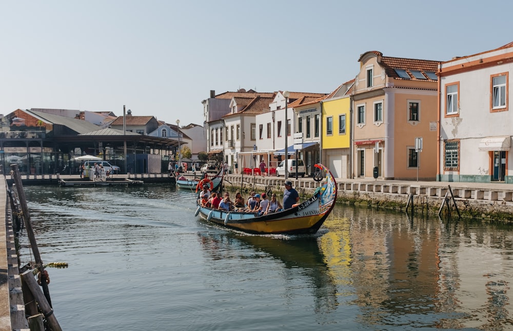 a group of people riding in a boat down a river