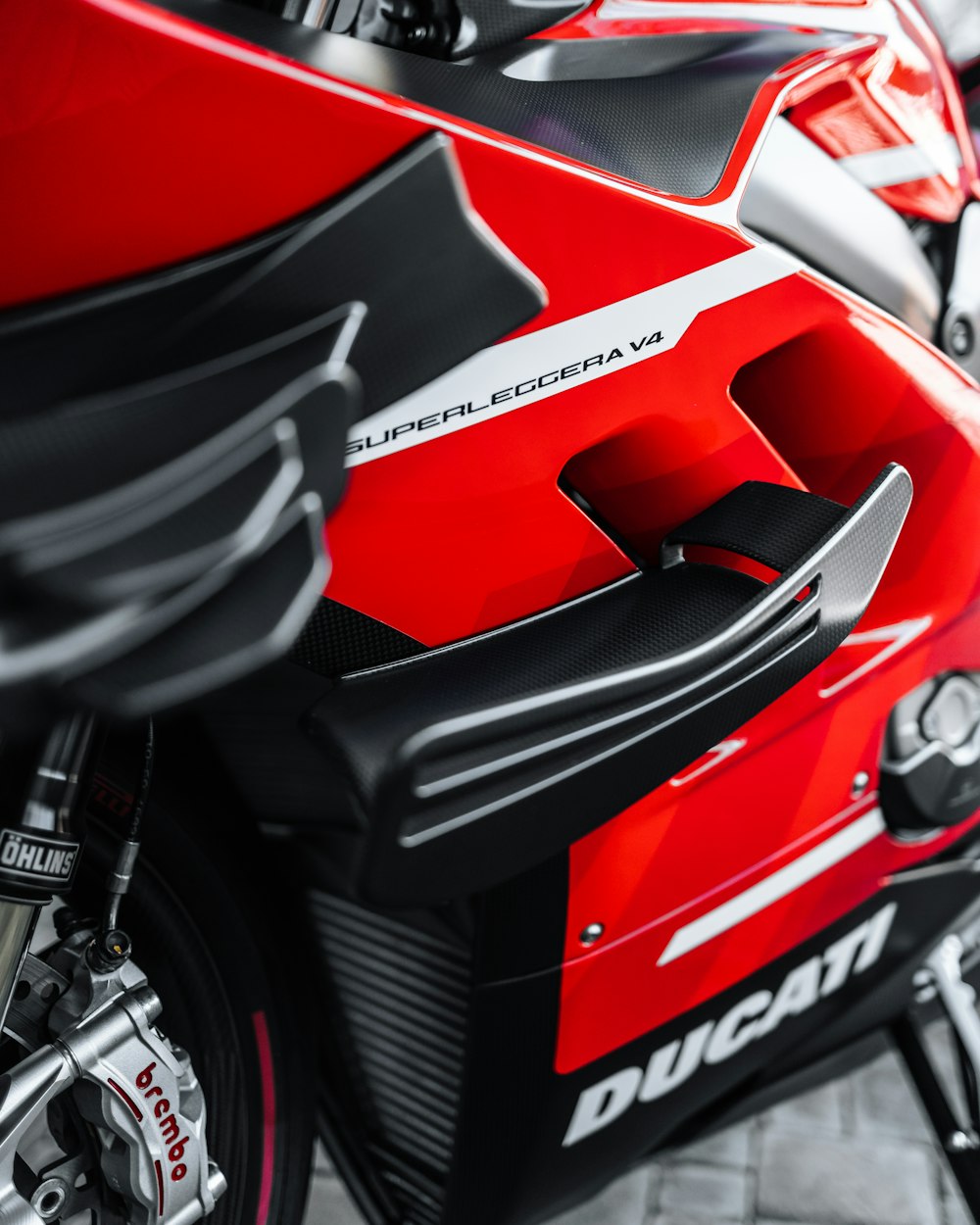 a close up of a red and black motorcycle