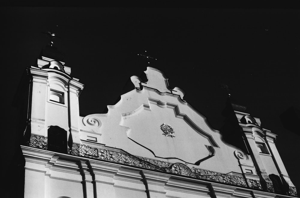 a black and white photo of a clock tower