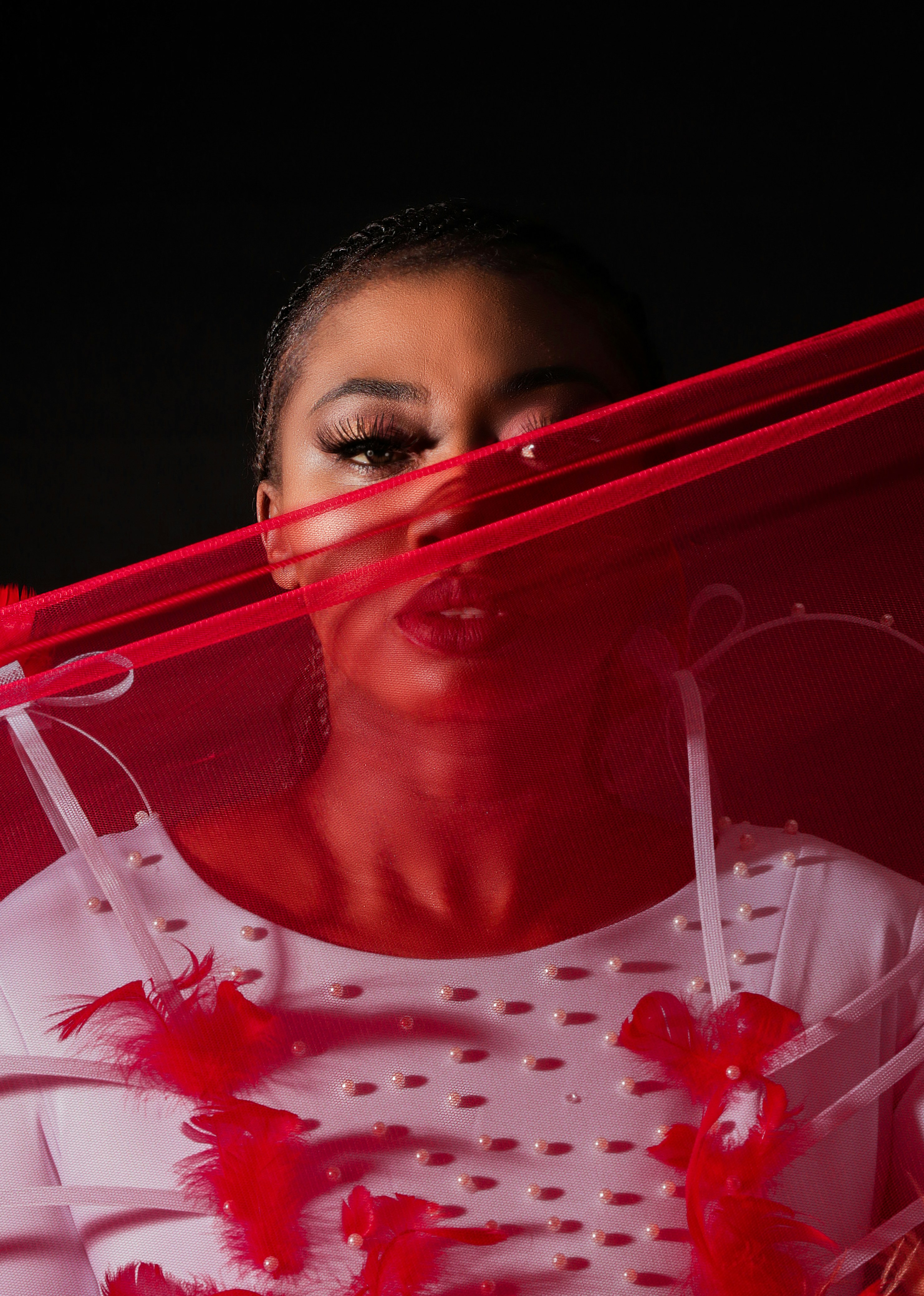 A woman in a white dress with red feathers photo – Free South africa ...
